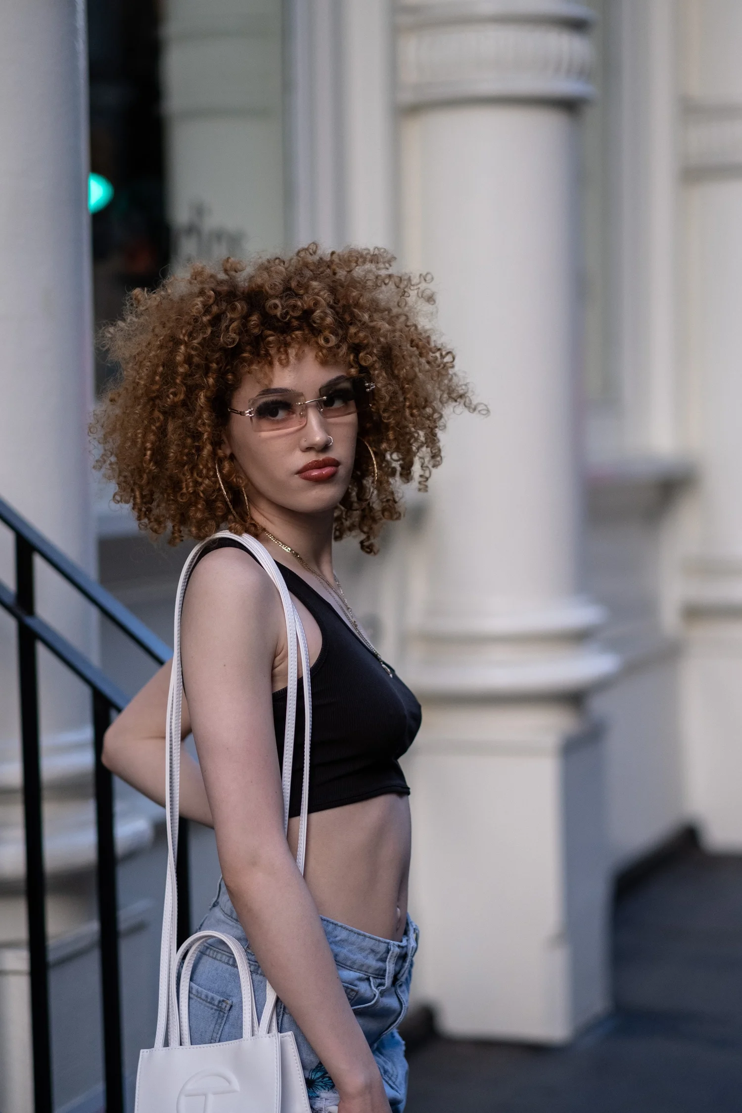 Portrait — woman on a stoop